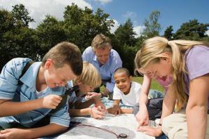 Teacher and pupils looking at map